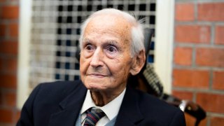 FILE - Leon Schwarzbaum poses for a photo in his home during an interview with the Associated Press in Berlin, Dec. 12, 2019. Schwarzbaum, holocaust survivor of the Nazis’ death camp at Auschwitz and lifelong fighter for justice for the victims of the Holocaust, has died. He was 101. Schwarzbaum died early Monday in Potsdam near Berlin.