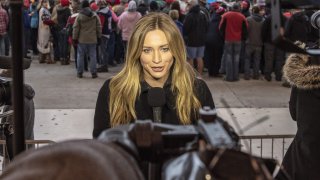 FILE - Ellison Barber covers a “Make America Great Again” rally at the Bozeman Yellowstone International Airport on Nov. 3, 2018 in Belgrade, Montana.