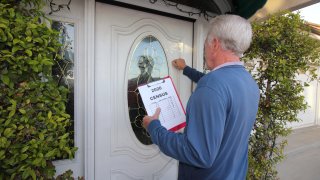 Man Canvassing Door to Door for the 2020 Census