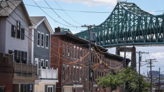 CHELSEA – JULY 15: The Tobin bridge abuts Chelsea housing in Chelsea, MA on July 15, 2020.