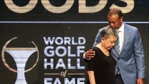 Woods and his mother Kultida share a sweet moment before the famous golfer was inducted into the World Golf Hall of Fame on March 9, 2022.