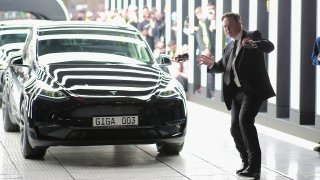 Tesla CEO Elon Musk dances at the official opening of Tesla’s Berlin-Brandenburg Gigafactory in Germany on March 22, 2022.