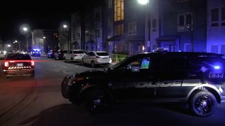 Somerville police investigate shots fired on Memorial Road Tuesday night.