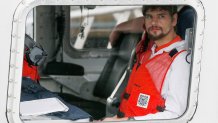 Nathan Carman arrives in a small boat at the US Coast Guard station, in Boston, Tuesday, Sept. 27, 2016. Carman is to be arraigned in federal court May 11, 2022, in Rutland, Vermont, on charges of killing his mother during a fishing trip at sea to inherit the family's wealth.