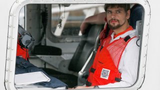 Nathan Carman arrives in a small boat at the US Coast Guard station, in Boston, Tuesday, Sept. 27, 2016. Carman is to be arraigned in federal court May 11, 2022, in Rutland, Vermont, on charges of killing his mother during a fishing trip at sea to inherit the family's wealth.