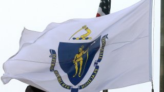 In this Monday, May 2, 2016, file photo, the Massachusetts state flag flies in front of Boston City Hall