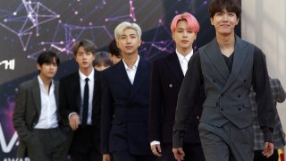 Members of South Korean K-Pop group BTS arrive to attend The Fact Music Awards in Incheon, South Korea