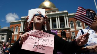 Jane Marcus of Medford chants during a rally held outside of the Massachusetts State House in Boston to protest restrictive abortion laws recently passed in several states on May 21, 2019.