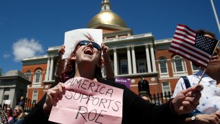 Jane Marcus of Medford chants during a rally held outside of the Massachusetts State House in Boston to protest restrictive abortion laws recently passed in several states on May 21, 2019.