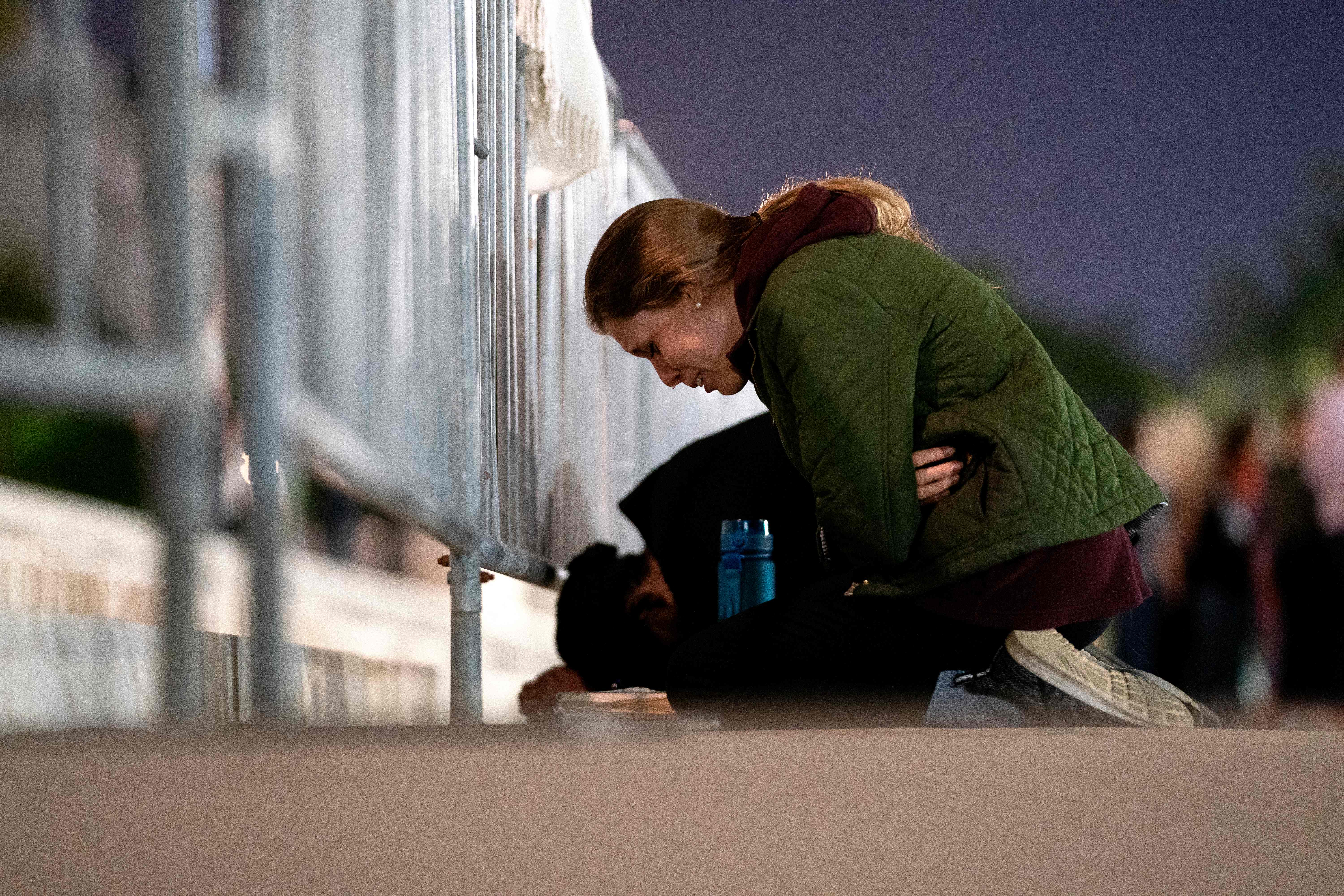 A women cries while kneeling in front of the US Supreme Court in Washington, DC, on May 2, 2022. &#8211; The Supreme Court is poised to strike down the right to abortion in the US, according to a leaked draft of a majority opinion that would shred nearly 50 years of constitutional protections. The draft, obtained by Politico, was written by Justice Samuel Alito, and has been circulated inside the conservative-dominated court, the news outlet reported. Politico stressed that the document it obtained is a  draft and opinions could change. The court is expected to issue a decision by June. The draft opinion calls the landmark 1973 Roe v Wade decision &#8220;egregiously wrong from the start.&#8221; (Photo by Stefani Reynolds / AFP) (Photo by STEFANI REYNOLDS/AFP via Getty Images)