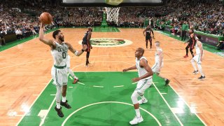 BOSTON, MA – MAY 23: Jayson Tatum #0 of the Boston Celtics grabs the rebound against the Miami Heat during Game 4 of the 2022 NBA Playoffs Eastern Conference Finals on May 23, 2022 at the TD Garden in Boston, Massachusetts. NOTE TO USER: User expressly acknowledges and agrees that, by downloading and or using this photograph, User is consenting to the terms and conditions of the Getty Images License Agreement. Mandatory Copyright Notice: Copyright 2022 NBAE (Photo by Brian Babineau/NBAE via Getty Images)