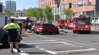 First responders at the scene of an SUV crash near Boston police headquarters on Wednesday, May 25, 2022.