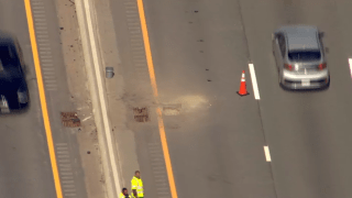 A small sinkhole on the Massachusetts Turnpike in Framingham on Thursday, May 12, 2022.