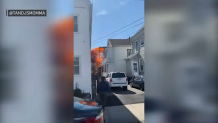 Flames shooting from a house fire in Salem, Massachusetts, on Monday, May, 9, 2022.