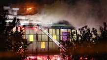 Firefighters battle a major blaze at Suffolk Downs, the former race track in East Boston, late Monday, May 30, 2022.