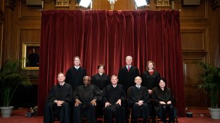 Seated from left: Associate Justice Samuel Alito, Associate Justice Clarence Thomas, Chief Justice John Roberts, Associate Justice Stephen Breyer and Associate Justice Sonia Sotomayor, standing from left: Associate Justice Brett Kavanaugh, Associate Justice Elena Kagan, Associate Justice Neil Gorsuch and Associate Justice Amy Coney Barrett pose during a group photo of the Justices at the Supreme Court in Washington, DC