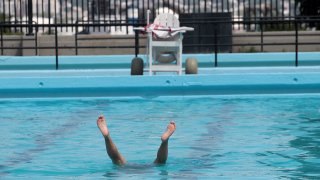 This 2016 file photo shows someone in the water at BCYF Clougherty Pool in Boston's Charlestown neighborhood.