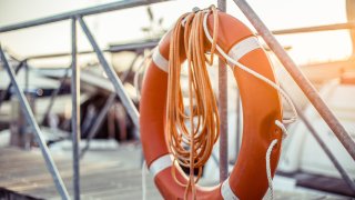 An orange life ring on a pier