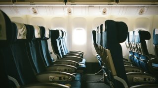 A file photo of empty seats on an airplane.