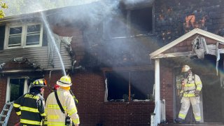 Firefighters putting out a blaze in Groveland, Massachusetts, on Friday, June 24, 2022.