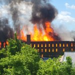 An abandoned mill in Orange, Massachusetts, goes up in flames on Saturday, June 4, 2022.