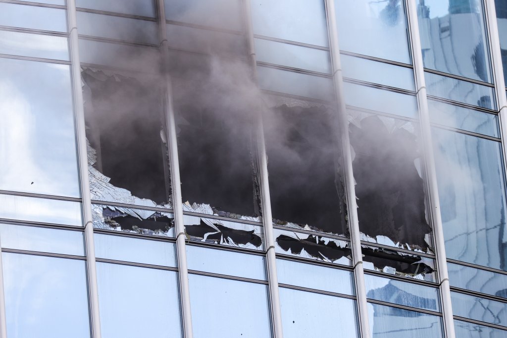 Smoke pours from blown-out windows in a Boston high-rise Friday, June 24, 2022.