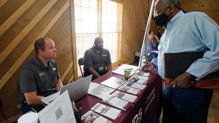 Robert Allen, director of work based learning, left, and Rod Mallett, work based learning coordinator, center, at Hinds Community College