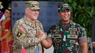 U.S. Chairman of the Joint Chiefs of Staff Gen. Mark Milley, left, shakes hands with Indonesian Armed Forces Chief Gen. Andika Perkasa