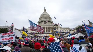 FILE – In this Jan. 6, 2021, file photo insurrections loyal to President Donald Trump rally at the U.S. Capitol in Washington.