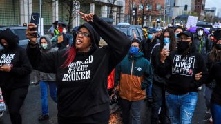 Boston – April 21: Monica Cannon-Grant leads demonstrators as they march from Nubian Square to BPD headquarters as they celebrate the conviction of former Minneapolis police officer Derek Chauvin and demand for an end to police brutality in Boston on April 21, 2021. (Photo by Erin Clark/The Boston Globe via Getty Images)