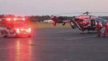 A skydiver was transported by helicopter to Orange Airport, Sunday night, July 10, 2022.