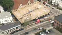 A crane that fell onto a building under construction in Boston's Dorchester neighborhood on Tuesday, July 26, 2022.