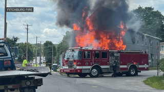Firefighters battling a house fire in Fitchburg, Massachusetts, on Thursday, July 14, 2022.