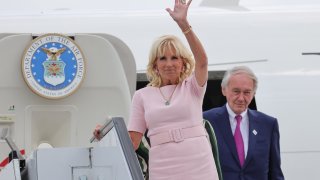 First lady Jill Biden arrives in Boston with Sen. Ed Markey behind her on Thursday, July 14, 2022.