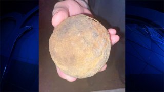The relatives of an avid antiquer cleaning out his home in Mansfield, Massachusetts, after he died discovered this object, what turned out to be a live Civil War-era cannonball, police said.