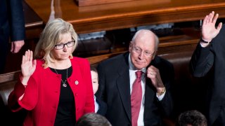 Former Vice President Dick Cheney looks on as his daughter Rep. Liz Cheney, R-Wyo., takes the oath of office on the House floor on Tuesday, Jan. 3, 2017.