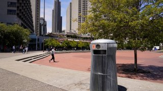 A prototype trash can called Salt and Pepper is seen near the Embarcadero in San Francisco on July 26, 2022. The pricey, boxy bin is one of three custom-made trash cans the city is testing this summer as part of its yearslong search for another tool to fight its battle against dirty streets.