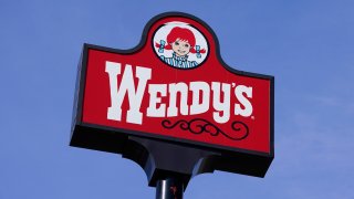 A photo shows a sign over a Wendy's restaurant in Des Moines, Iowa, on Feb. 25, 2021.