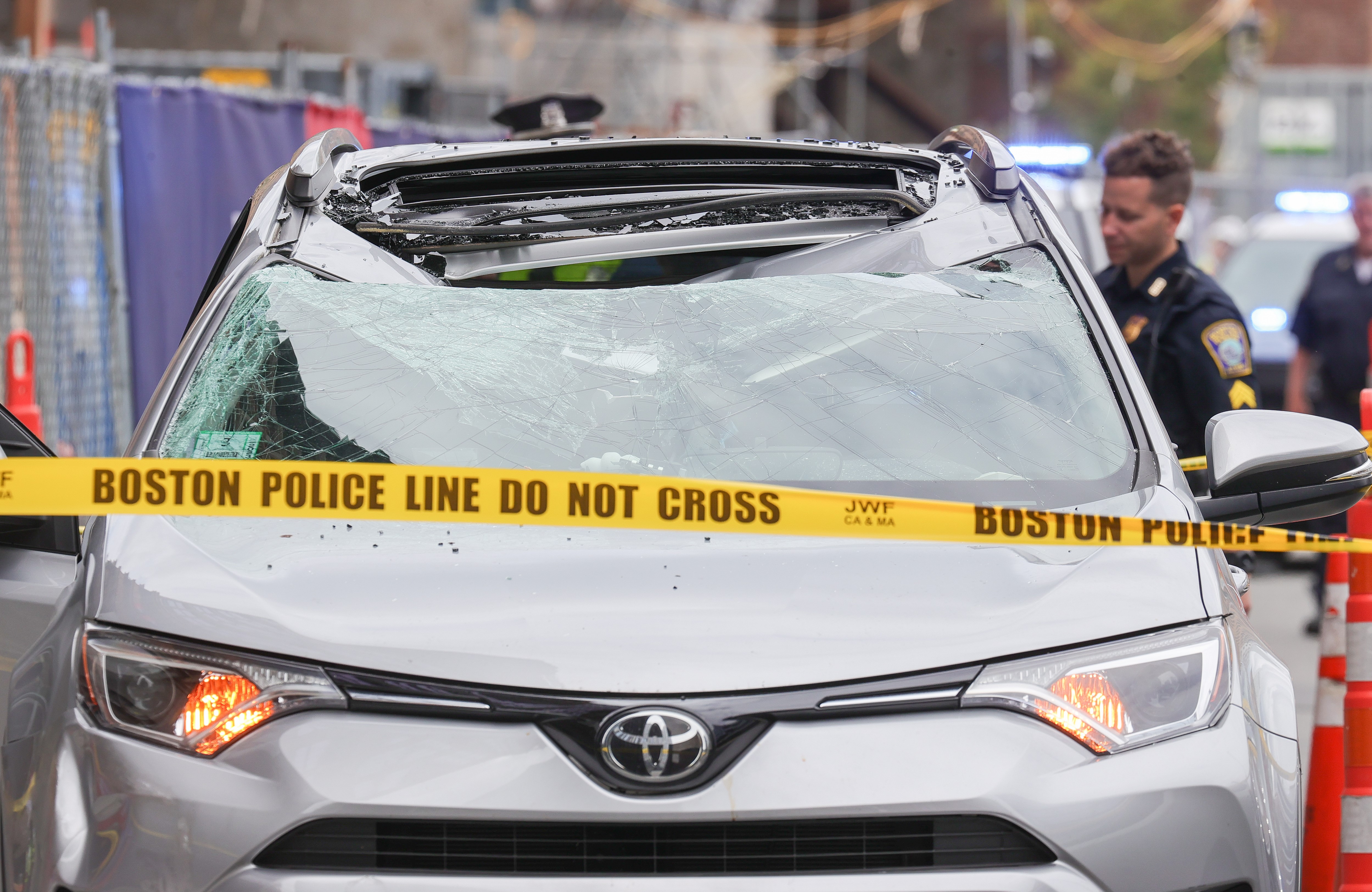 A damaged vehicle at a construction site in Boston on Wednesday, Aug. 17, 2022.