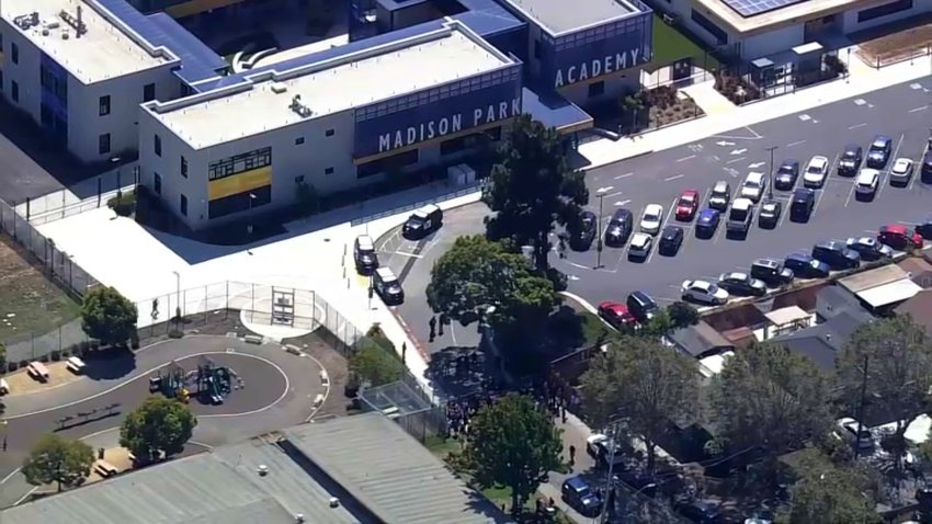 Authorities investigate a shooting at Madison Park Academy in Oakland.