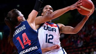 Alyssa Thomas of Team USA attempts a shot with Serbia's Dragana Stankovic at defense, left, during the first quarter final of the Women's Basketball World Cup game between Serbia and the US in Sydney, Sept. 29, 2022.