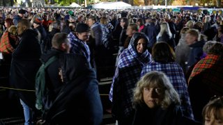 Bundled up against the cold, members of the public near the end of their 12-hour wait