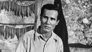 FILE - Actor Henry Silva on set of the movie “The Secret Invasion” in 1964.