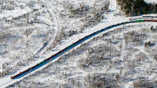 This February 2015 file photo shows a freight train south of Bangor, Maine.