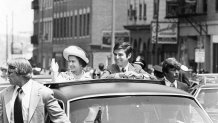 Queen Elizabeth II rides with Gov. Michael Dukakis through the North End during her visit to Boston on July 11, 1976.