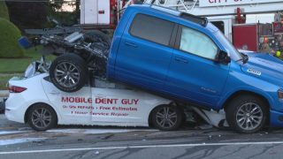 A truck ends up on top of another car during a crash in Cranston, Rhode Island Thursday evening.