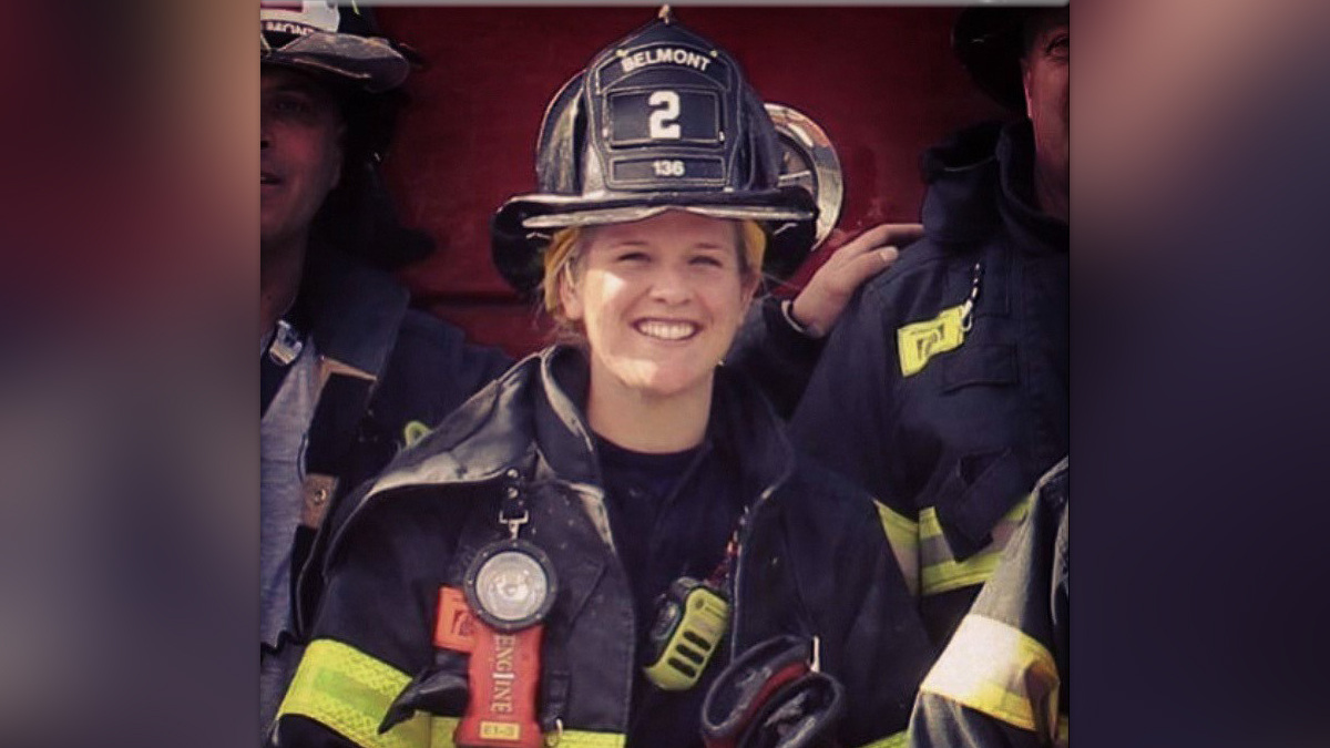 a woman in a firefighter uniform