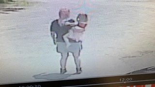 A still image from surveillance footage showing a father and daughter police were searching for in Maine over the summer.