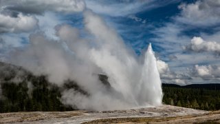 The iconic Old Faithful Geyser springs to life (every 90 minutes) in Yellowstone National Park’s Upper Geyser Basin on September 18, 2022, in Yellowstone National Park, Wyoming. Sitting atop an active volcanic caldera, Yellowstone, America’s first National Park, is home to more geological hydrothermal features (geysers, mud pots, hot springs, fumaroles) than are found in the rest of the world combined.