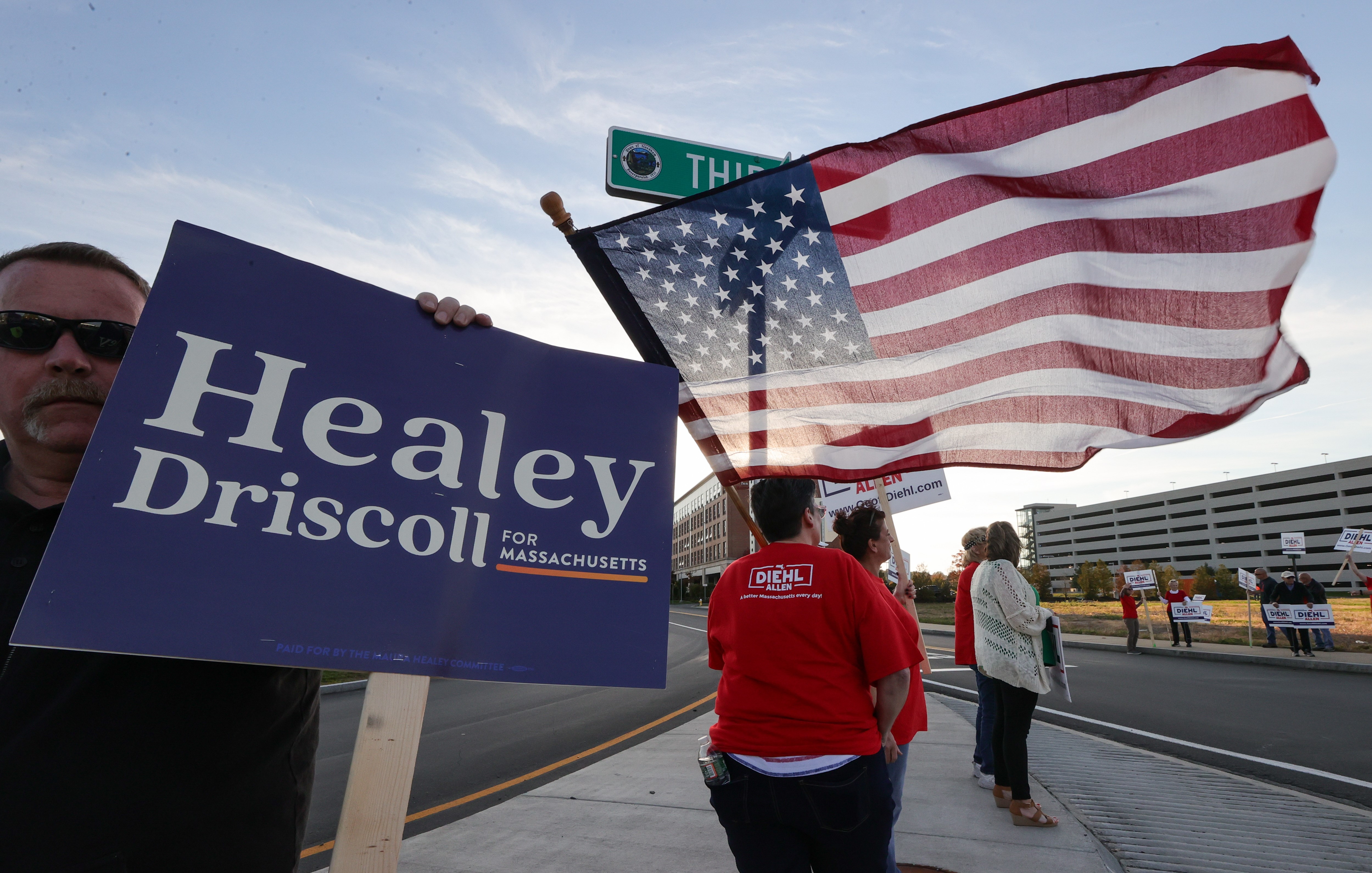 Supporters of Democrat Maura Healey and Republican Geoff Diehl outside the Boston Media Center before the candidates’ first debate in the Massachusetts governor’s race.